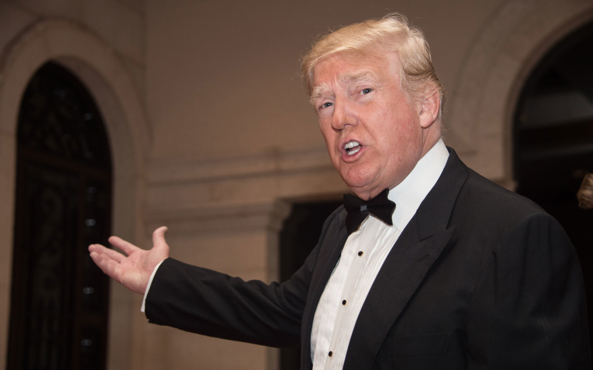 President Donald Trump arrives for a new year's party at his Mar-a-Lago resort in Palm Beach, Florida, on December 31, 2017.