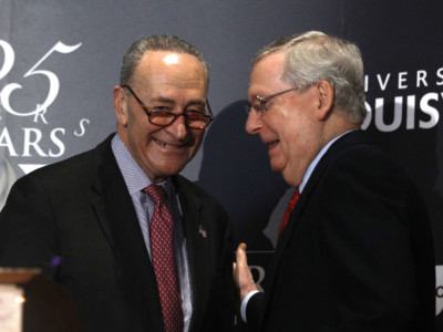 Senate Majority Leader Mitch McConnell and Senate Democratic Leader Chuck Schumer shake hands after Shumer delivered a speech at the University of Louisville's McConnell Center on February 12, 2018, in Louisville, Kentucky.