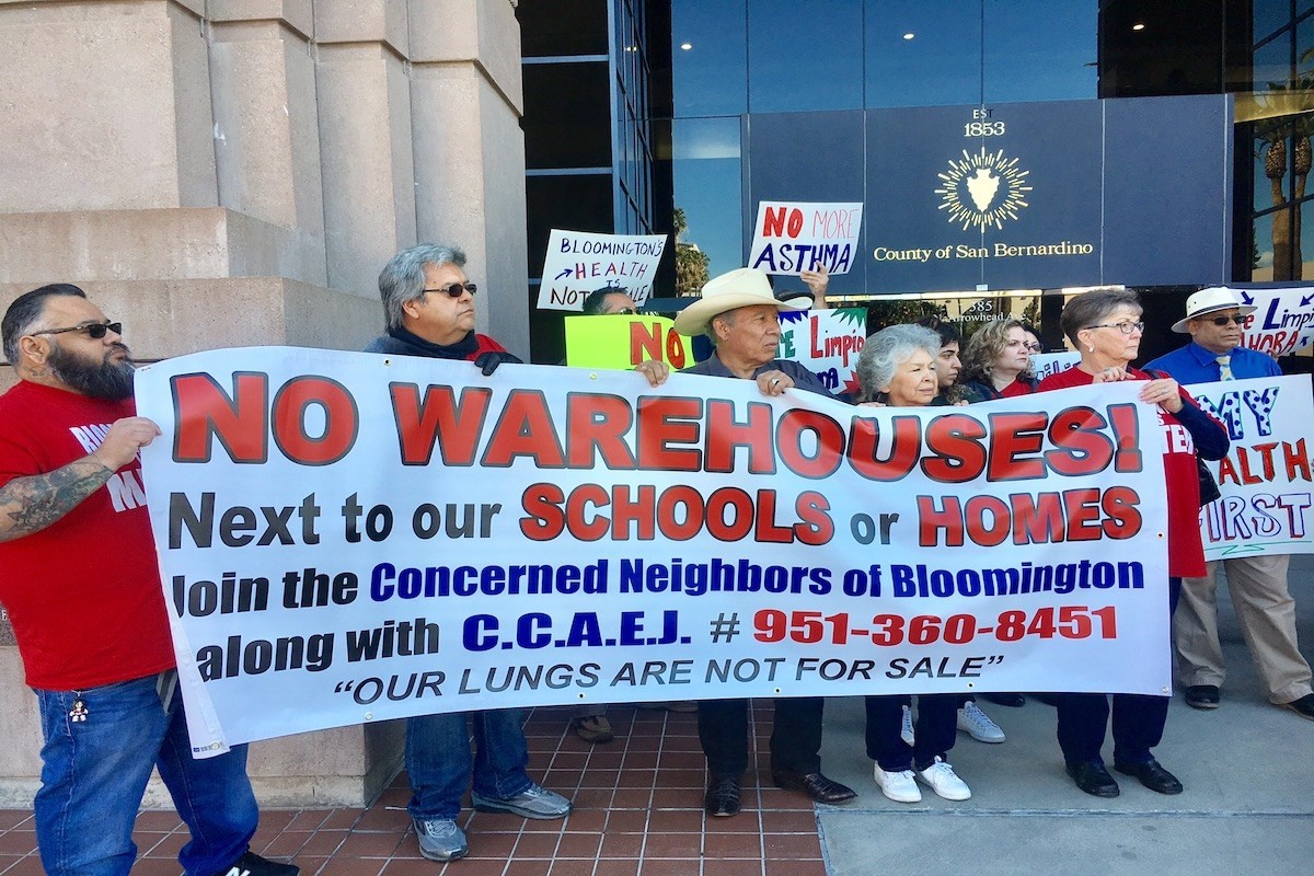 Bloomington residents and environmental advocates gathered outside the San Bernardino County Government Center in February 2018 to protest warehouse development plans.