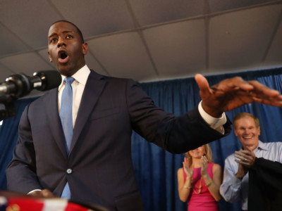 Andrew Gillum, the Democratic candidate for Florida governor, speaks as Sen. Bill Nelson (D-FL) listen behind him during a campaign rally at the International Union of Painters and Allied Trades on August 31, 2018 in Orlando, Florida.
