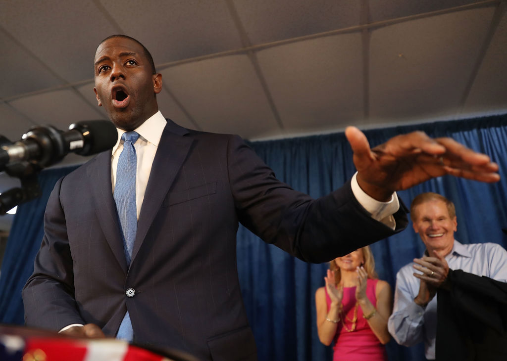 Andrew Gillum, the Democratic candidate for Florida governor, speaks as Sen. Bill Nelson (D-FL) listen behind him during a campaign rally at the International Union of Painters and Allied Trades on August 31, 2018 in Orlando, Florida.