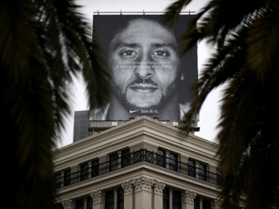 A billboard featuring former San Francisco 49ers quaterback Colin Kaepernick is displayed on the roof of a Nike store on September 5, 2018, in San Francisco, California.