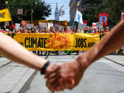 Crowds march up Market Street during the "Rise For Climate" global action on September 8, 2018, in downtown San Francisco, California.