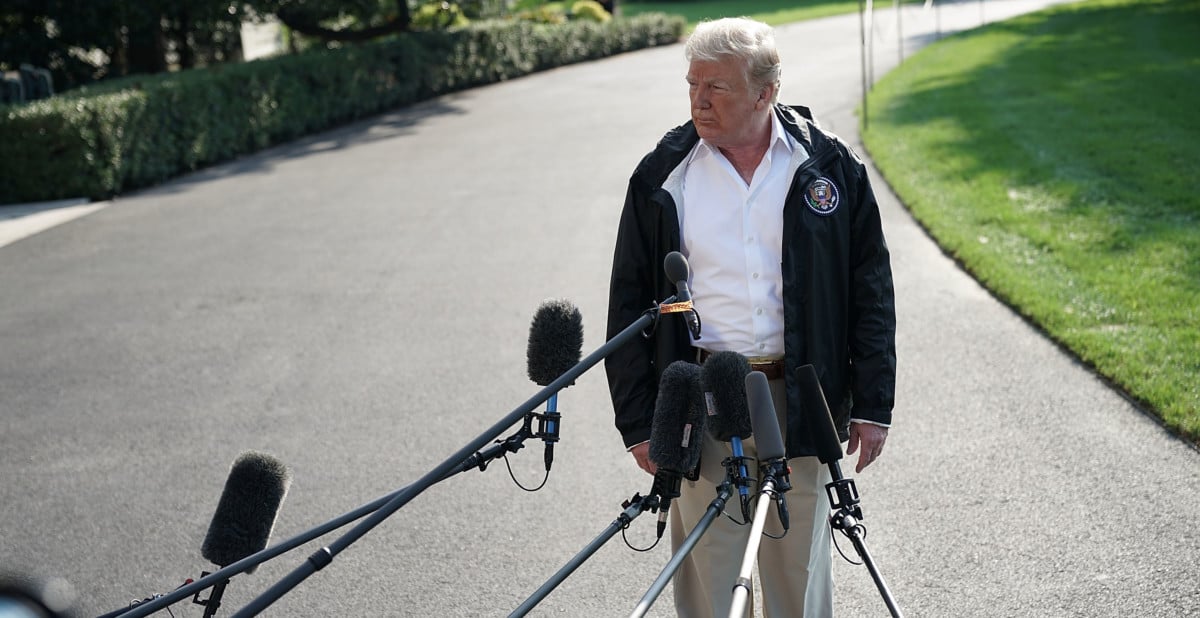 Donald Trump speaks to members of the media prior to a Marine One departure at the south lawn of the White House September 19, 2018, in Washington, DC.