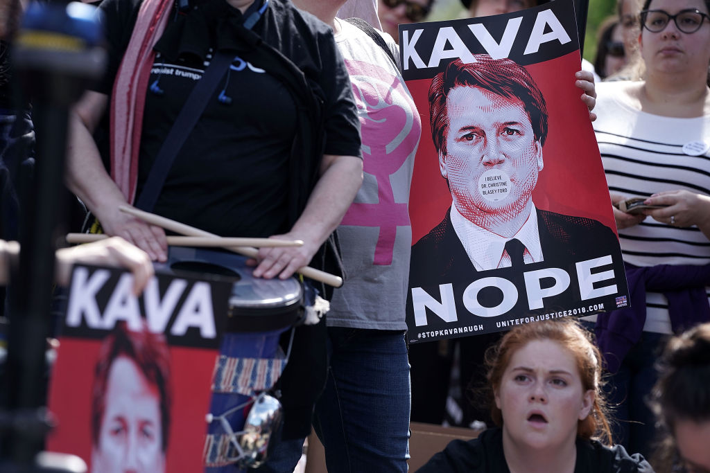 Activists participate in a rally in front of the US Supreme Court September 28, 2018, in Washington, DC.