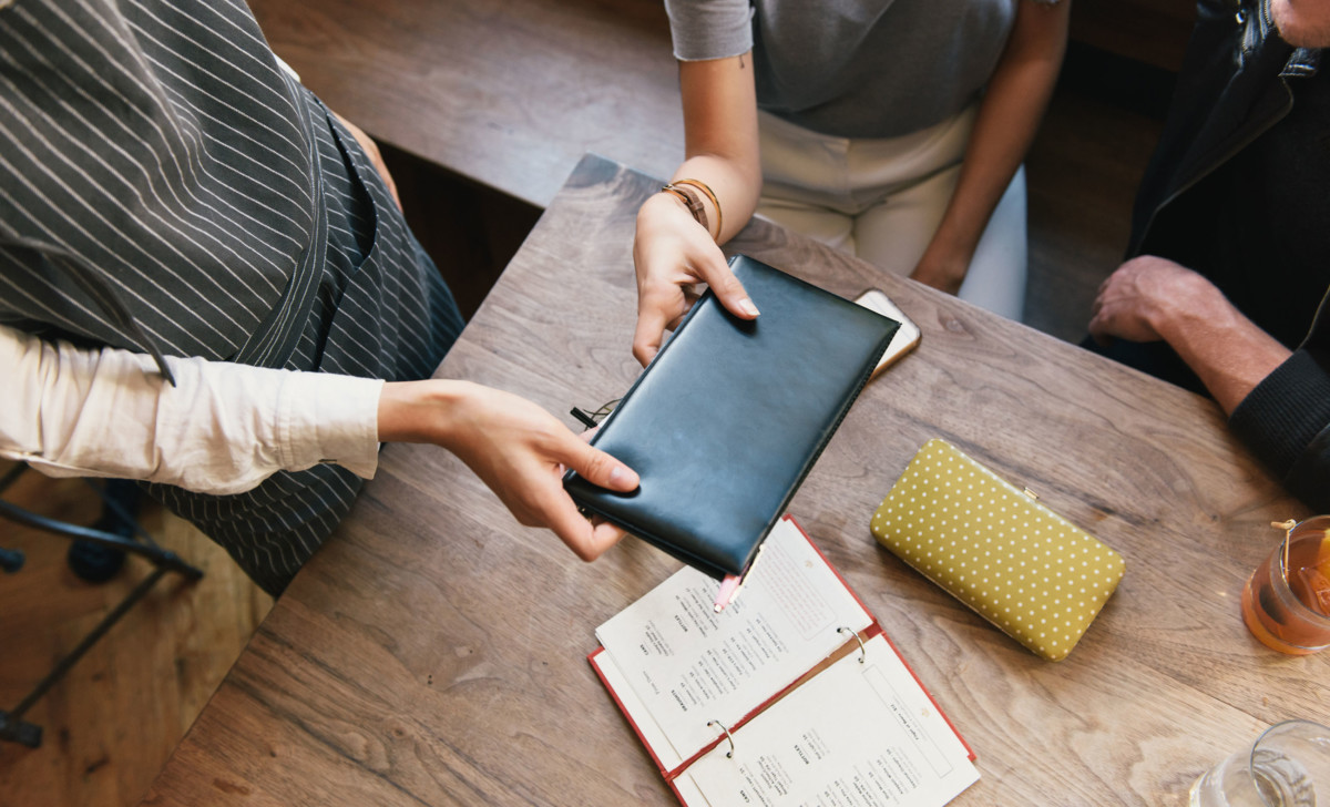 Server picks up check at restuarant