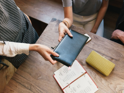 Server picks up check at restuarant