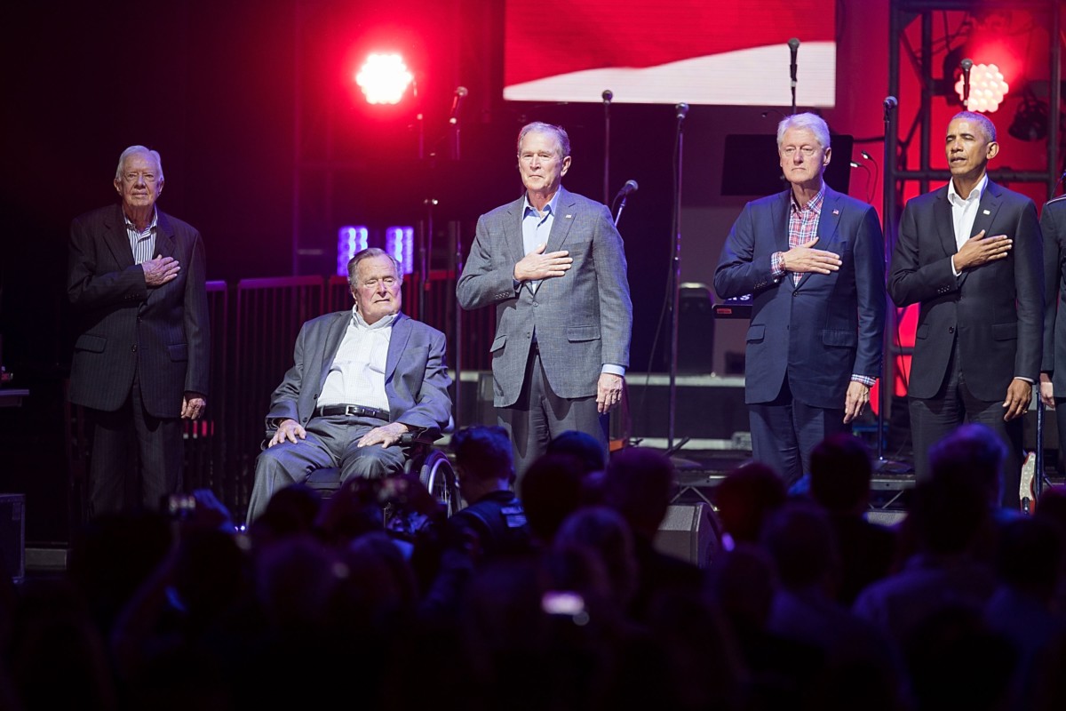 (From left to right) Former United States Presidents Jimmy Carter, George H.W. Bush, George W. Bush, Bill Clinton and Barack Obama address the audience during the "Deep from the Heart: The One America Appeal Concert" at Reed Arena on the campus of Texas A&M University on October 21, 2017, in College Station, Texas.