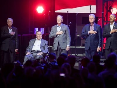 (From left to right) Former United States Presidents Jimmy Carter, George H.W. Bush, George W. Bush, Bill Clinton and Barack Obama address the audience during the "Deep from the Heart: The One America Appeal Concert" at Reed Arena on the campus of Texas A&M University on October 21, 2017, in College Station, Texas.