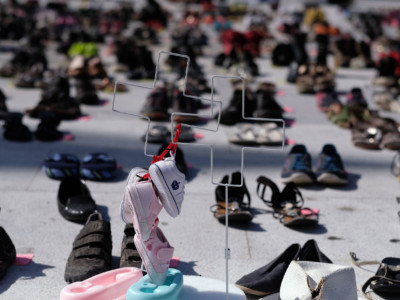 Shoes are displayed in memory of those killed by Hurricane Maria in front of the Puerto Rican Capitol in San Juan on June 1, 2018.