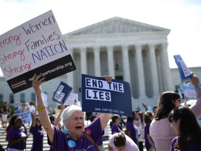 Supporters of reproductive rights protest outside the US Supreme Court as it issues a ruling on a California law related to abortion issues on June 26, 2018, in Washington, DC.