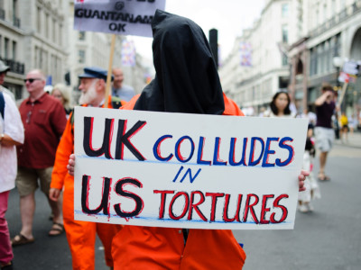 A demonstrator dressed in orange prison scrubs attends a mass demonstration opposing the UK visit of President Donald Trump in London, England, on July 13, 2018.