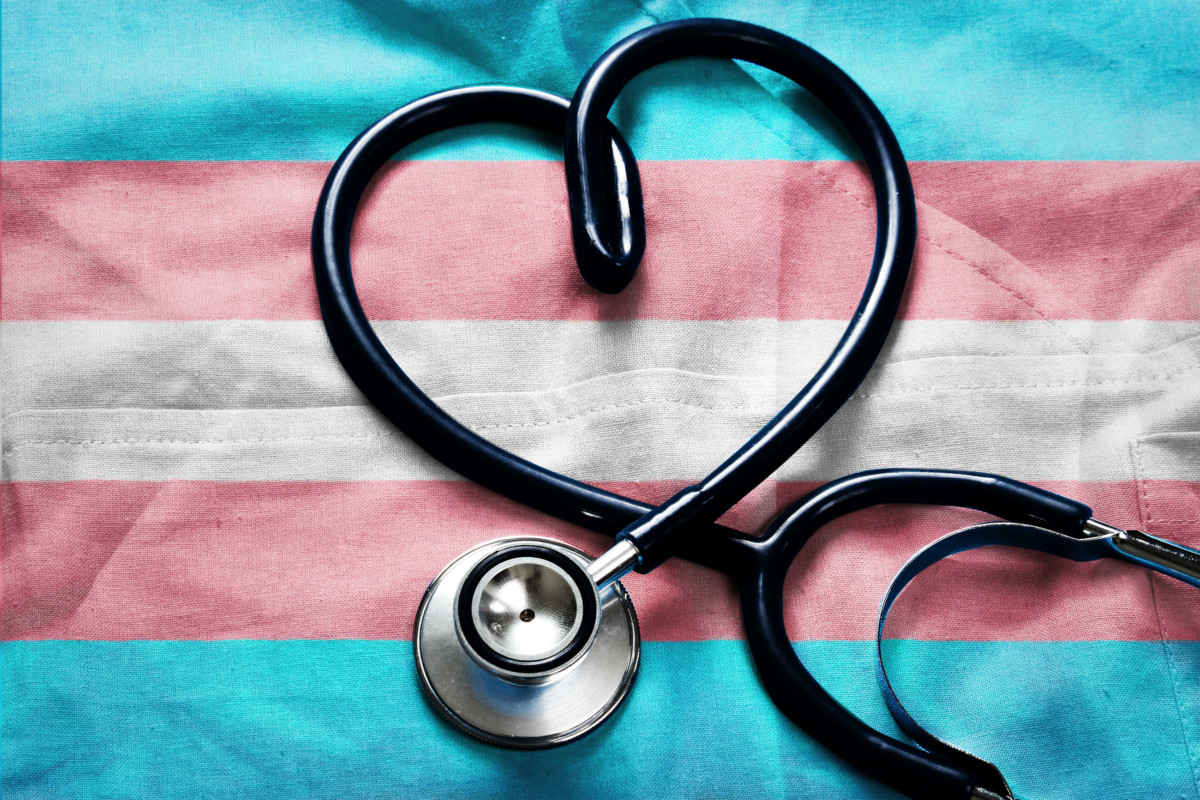 Transgender flag underneath stethoscope