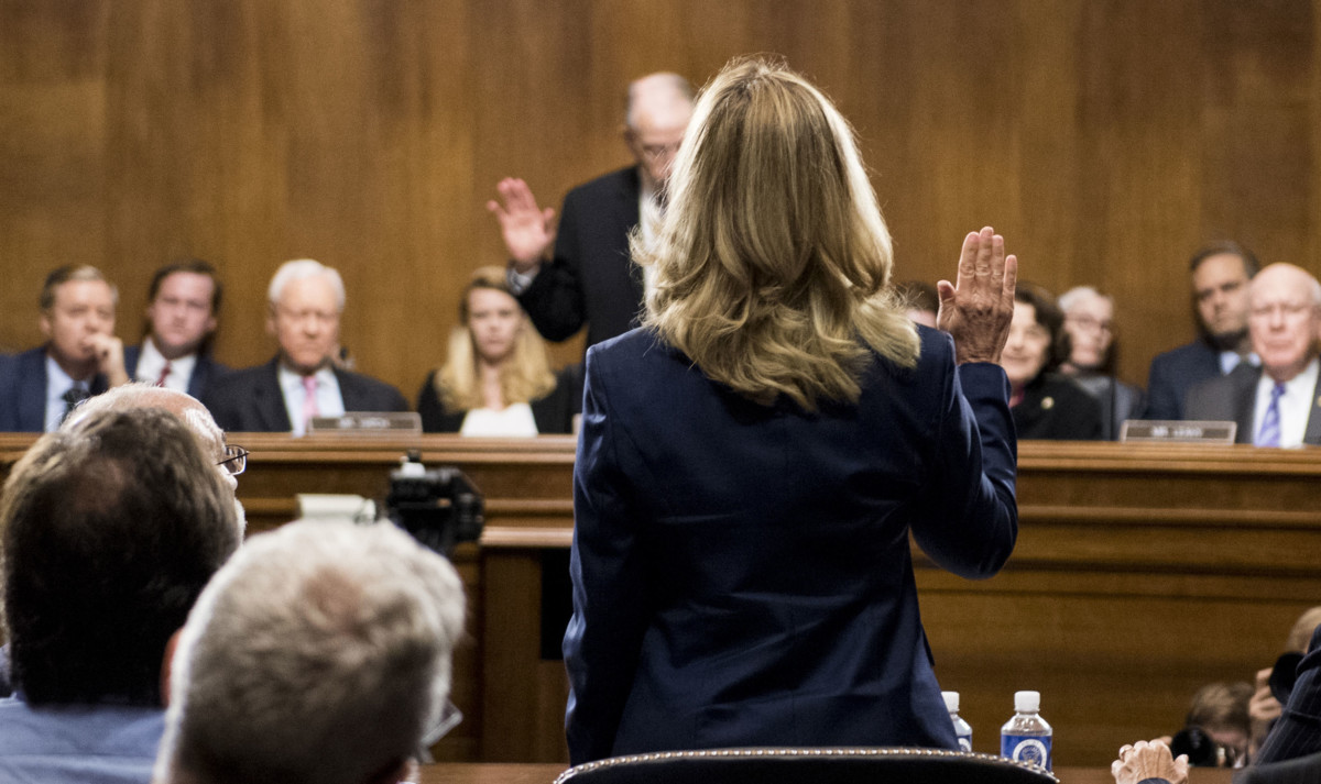 Dr. Christine Blasey Ford is sworn in by Chairman Chuck Grassley on Capitol Hill, September 27, 2018, in Washington, DC.