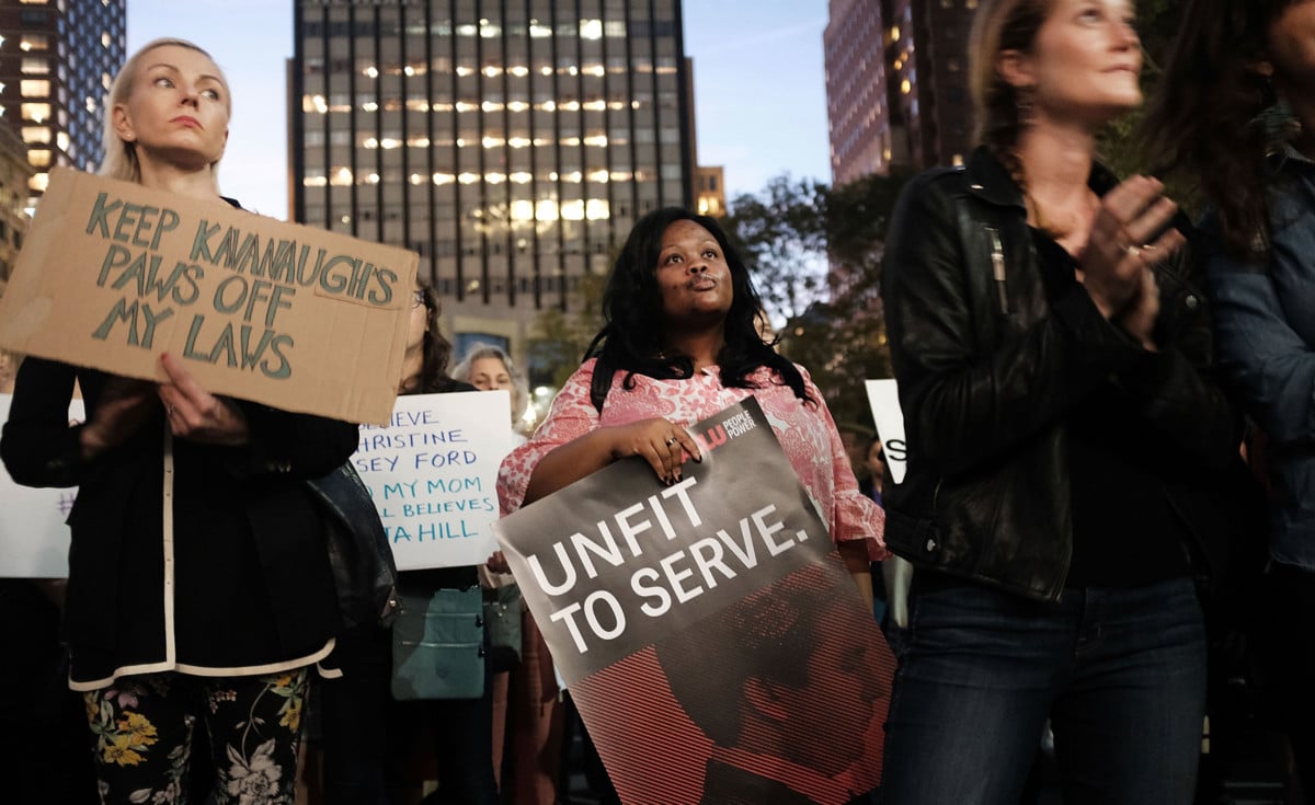 Women attend a rally and vigil in front of a Brooklyn court house calling to stop the nomination of Supreme Court candidate Judge Brett Kavanaugh on October 3, 2018, in New York City.
