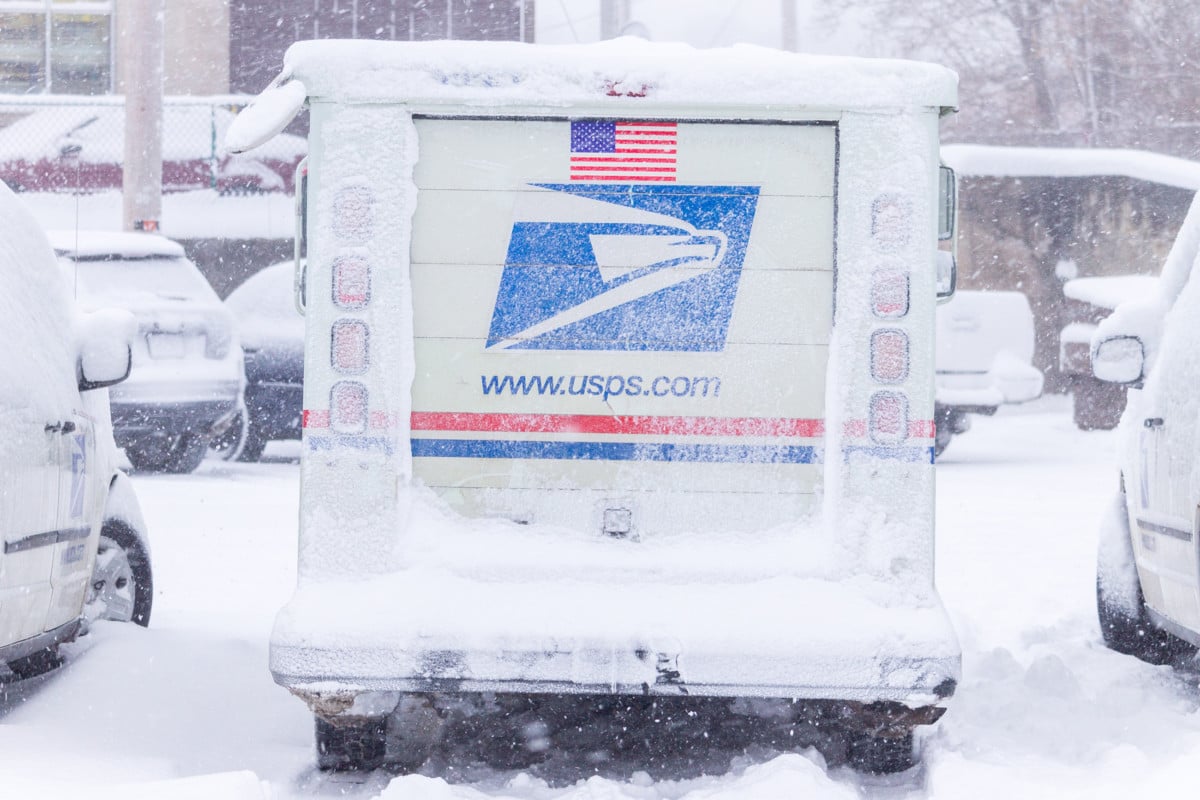 USPS truck in snow