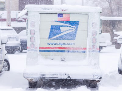 USPS truck in snow