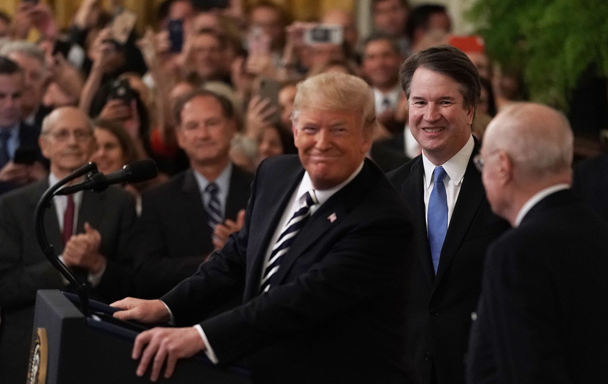President Trump speaks as Supreme Court Justice Brett Kavanaugh and retired Justice Anthony Kennedy look on during Kavanaugh's ceremonial swearing in at the east room of the White House on October 8, 2018, in Washington, DC.