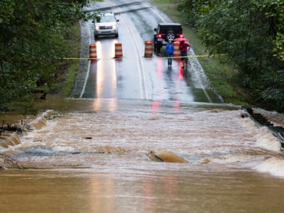 Motorists inspect a road flooded by rain from Hurricane Florence in Waxhaw, North Carolina, September 16, 2018.