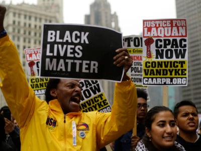 Demonstrators protest as they celebrate the verdict in the murder trial of Chicago police officer Jason Van Dyke along Michigan Avenue on October 5, 2018, in Chicago, Illinois.