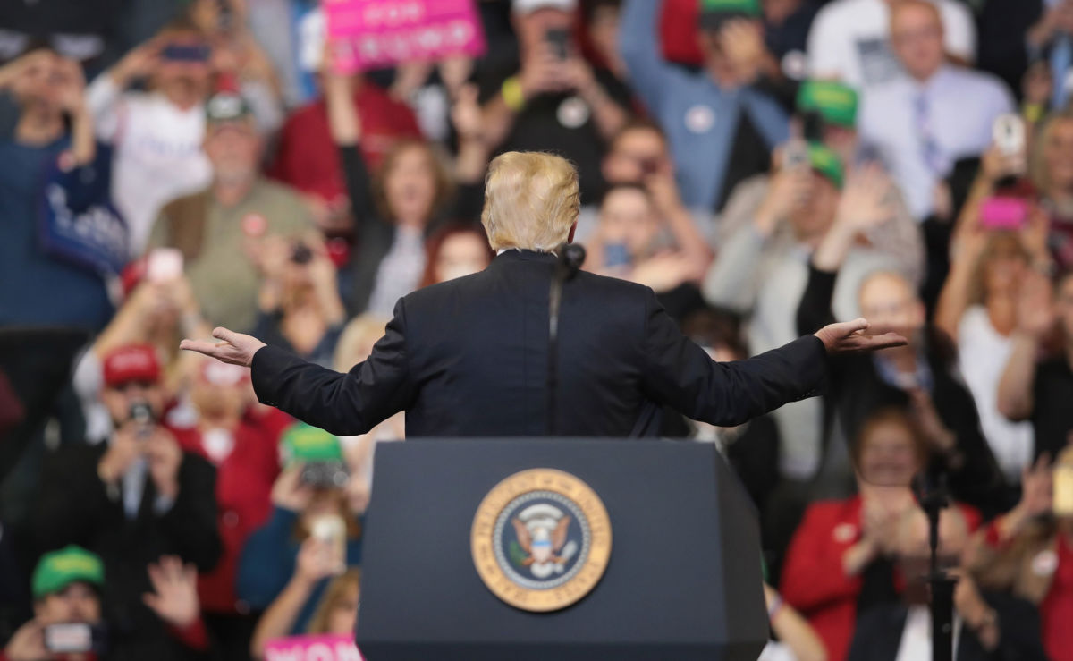 President Donald Trump gestures to supporters as he finishes a campaign rally at the Mid-America Center on October 9, 2018, in Council Bluffs, Iowa.