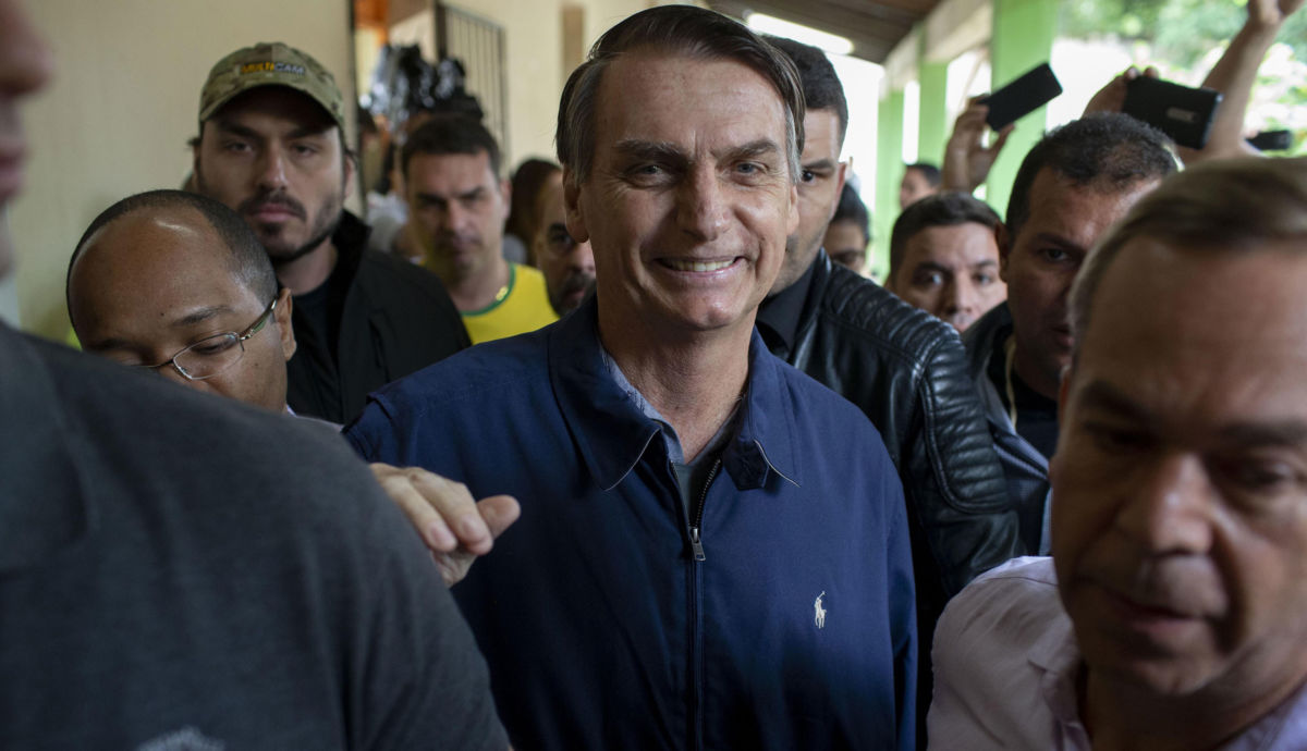 Brazil's right-wing presidential candidate Jair Bolsonaro leaves after casting his vote during the general elections in Rio de Janeiro, Brazil, on October 7, 2018.