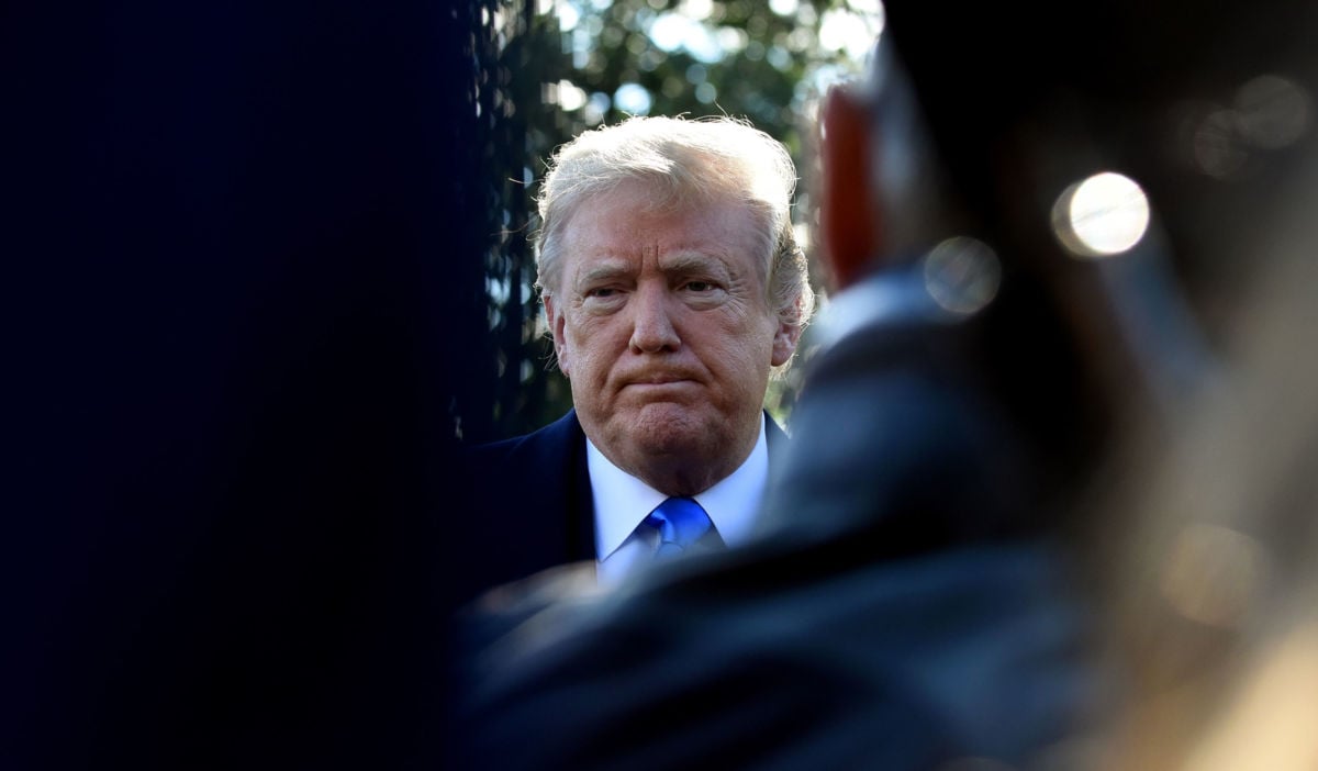 President Donald Trump speaks to reporters on the South Lawn before boarding Marine One at the White House on October 13, 2018, in Washington, DC.