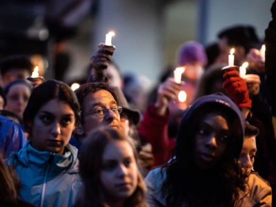 Mourners are seen holding candles in the aftermath of the mass shooting at the Tree of Life Synagogue in Squirrel Hill, Pittsburgh, Pennsylvania.