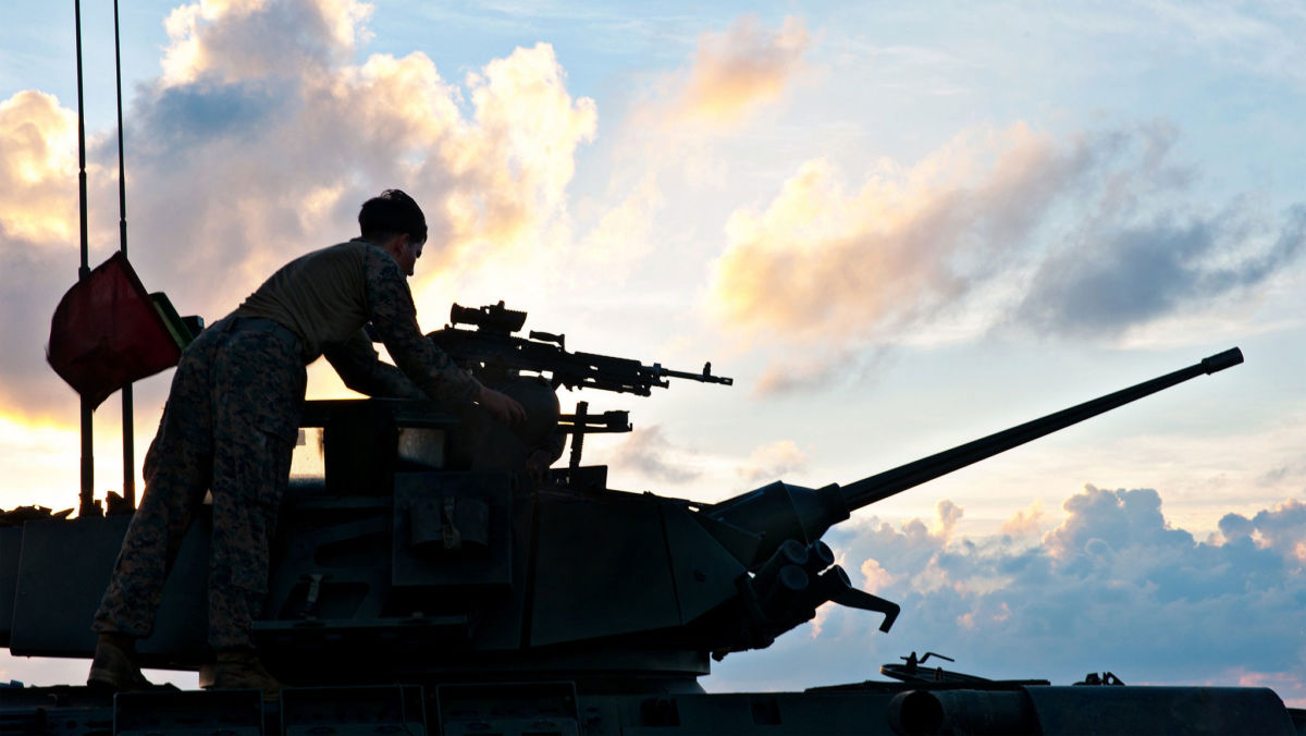 US Marines prepare to fire a light armored vehicle's chain gun on the flight deck of the USS Wasp in the South China Sea, September 24, 2018.