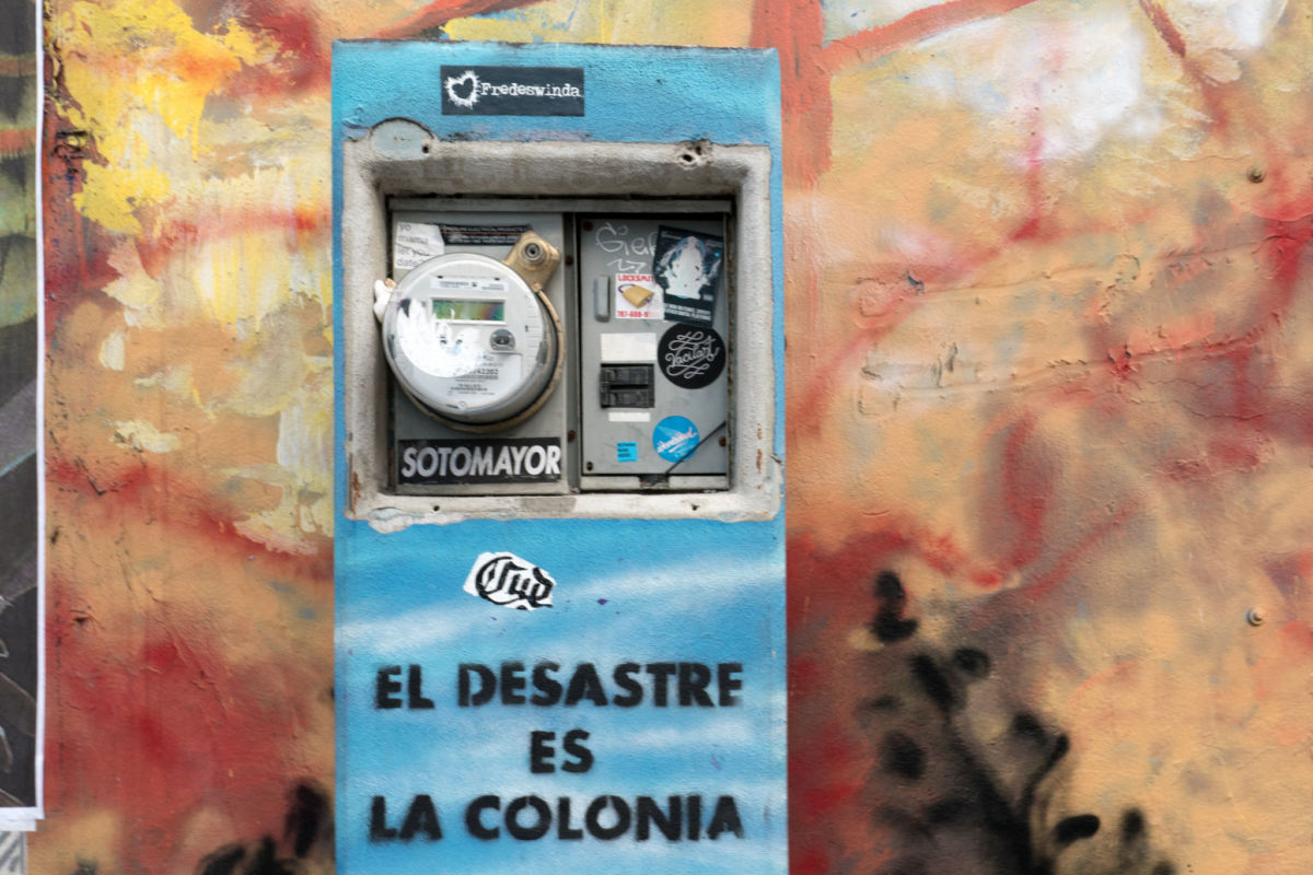 "The Disaster Is the Colony": Street graffiti in San Juan, Puerto Rico.