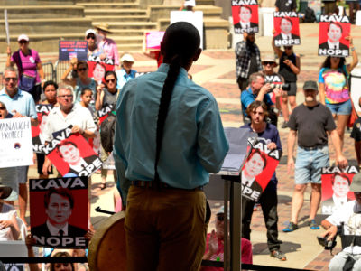 Speaker Matene Strikes First, of the Dakota and Ojibwe nations, speaks to the crowd during a rally to protest President Trump's then Supreme Court nominee Brett Kavanaugh at Civic Center Park on August 26, 2018, in Denver, Colorado.