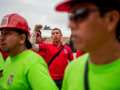 Members of the miners union take part in a demonstration in support of Mexican Senator Napoleon Gomez Urrutia during the inauguration of the new legislature in Mexico City, on August 29, 2018. Gomez Urrutia, a controversial mining leader, appeared Monday to swear in as senator for Morena, the party of Mexican leftist President-elect Andres Manuel Lopez Obrador.