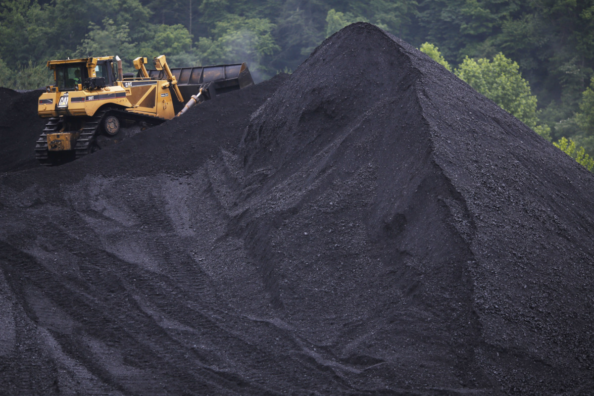 A bulldozer operates atop a coal mound at the CCI Energy Slones Branch Terminal June 3, 2014, in Shelbiana, Kentucky.