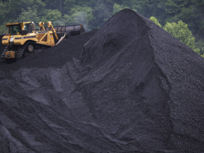 A bulldozer operates atop a coal mound at the CCI Energy Slones Branch Terminal June 3, 2014, in Shelbiana, Kentucky.