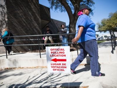 An official polling location sign stands outside a voting center on Super Tuesday, March 1, 2016, in Dallas, Texas.