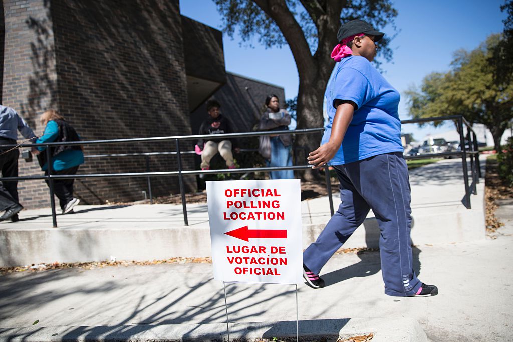 An official polling location sign stands outside a voting center on Super Tuesday, March 1, 2016, in Dallas, Texas.