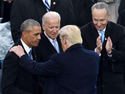 US President Donald Trump speaks with former President Barack Obama as former Vice President Joe Biden and New York Sen. Chuck Schumer look on during his inauguration ceremonies at the US Capitol in Washington, DC, on January 20, 2017.