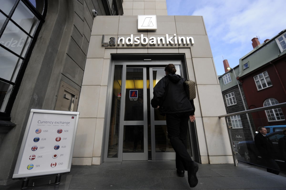 A woman enters a branch of Iceland's then-second largest bank, Landsbanki (Landsbankinn) on October 8, 2008 in Rejkjavik.