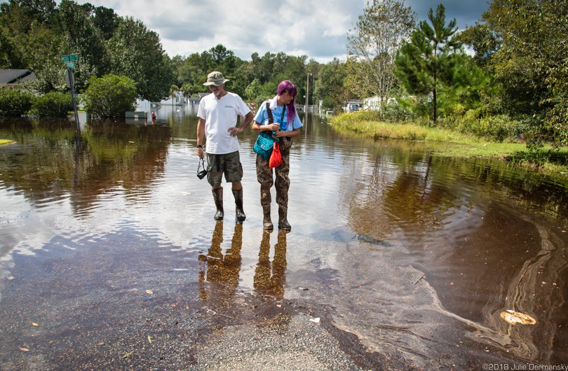 Jane (right) and Chris Ochsenbein in polluted floodwater in Bucksport, South Carolina.