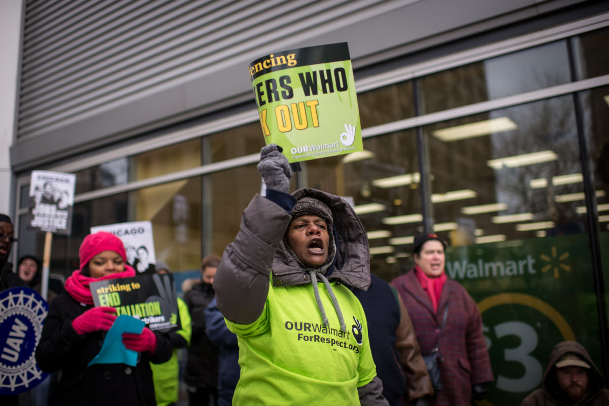 Walmart Workers and supporters strike outside of a Walmart Neighborhood Market in downtown Chicago, Illinois. November 28, 2014.