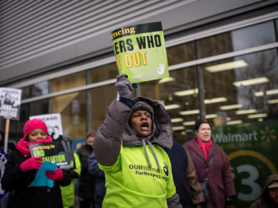 Walmart Workers and supporters strike outside of a Walmart Neighborhood Market in downtown Chicago, Illinois. November 28, 2014.