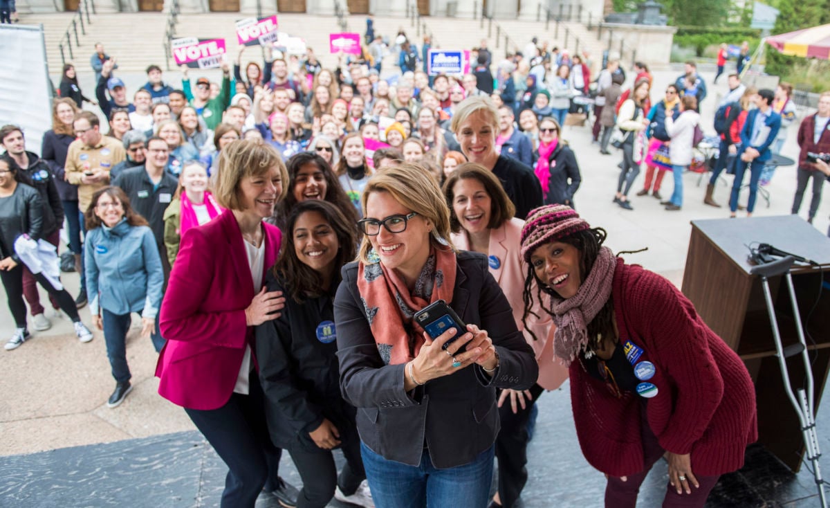 Peggy Flanagan, a Democratic candidate for Minnesota lieutenant governor, takes a selfie with Sen. Tina Smith (left), Cecile Richards (back right), Sen. Catherine Cortez Masto (second from right) and students, during an early voting rally at the University of Minnesota in Minneapolis on September 21, 2018.