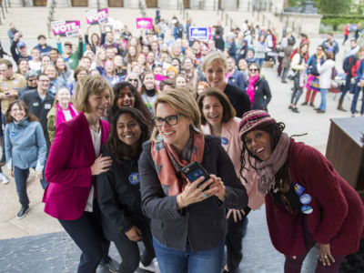 Peggy Flanagan, a Democratic candidate for Minnesota lieutenant governor, takes a selfie with Sen. Tina Smith (left), Cecile Richards (back right), Sen. Catherine Cortez Masto (second from right) and students, during an early voting rally at the University of Minnesota in Minneapolis on September 21, 2018.