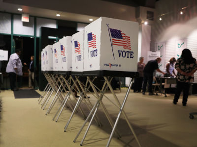 Voting booths are setup at the Yuengling center on the campus of University of South Florida as workers prepare to open the doors to early voters on October 22, 2018 in Tampa, Florida.