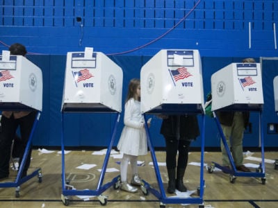 Voters cast their ballots during the midterm election at the High School Art and Design polling station in Manhattan, New York, on November 6, 2018.