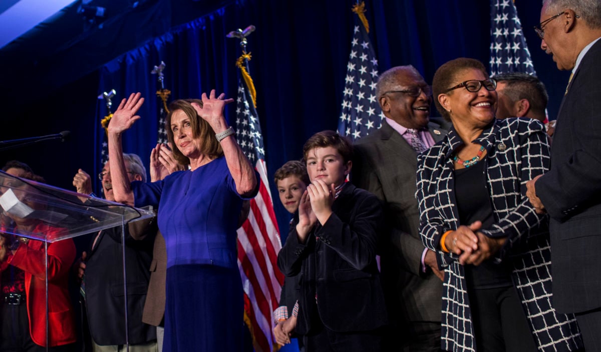 House Minority Leader Nancy Pelosi, joined by House Democrats, leaves the podium after delivering remarks during a DCCC election watch party at the Hyatt Regency on November 6, 2018, in Washington, DC.