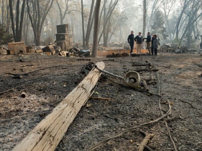 Governor-Elect Gavin Newson, FEMA Director Brock Long, President Trump, Paradise Mayor Jody Jones and Gov. Jerry Brown tour the Skyway Villa Mobile Home and RV Park during Trump's visit of the Camp Fire in Paradise, California, on November 17, 2018.