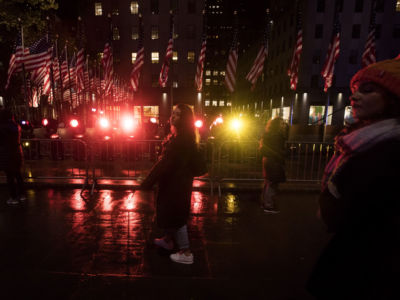 People watch the midterm election results on a screen at the Rockefeller Center in New York on November 6, 2018.