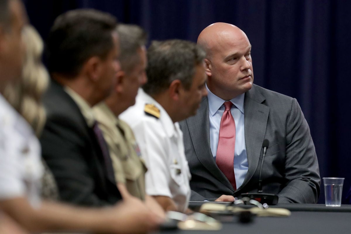 The Department of Justice Chief of Staff Matt Whitaker (right) participates in a round table event with Joint Interagency Task Force South foreign liaison officers at the Department of Justice Kennedy building on August 29, 2018, in Washington, DC.