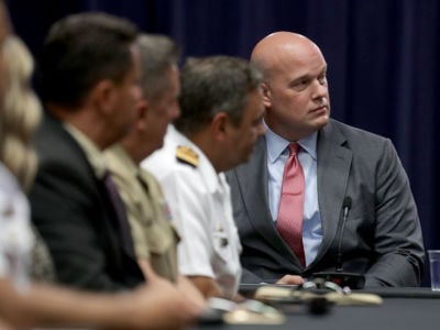 The Department of Justice Chief of Staff Matt Whitaker (right) participates in a round table event with Joint Interagency Task Force South foreign liaison officers at the Department of Justice Kennedy building on August 29, 2018, in Washington, DC.